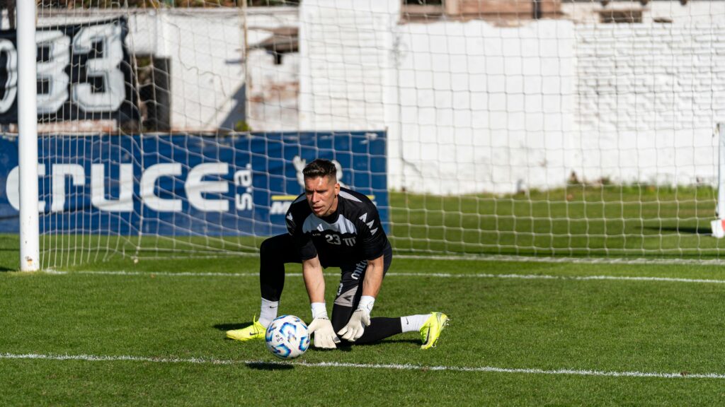 Soccer goalie diving to block a shot during practice — where skills feel automatic and the nervous system reads the environment as safe